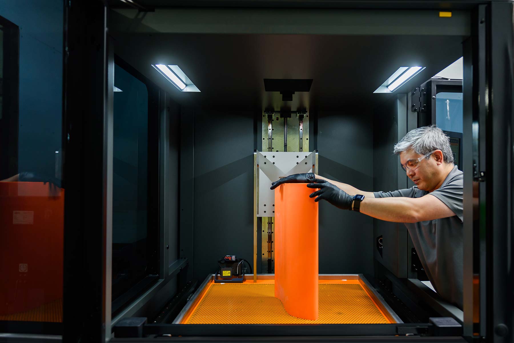 Airfoil being taken out of 3D printer